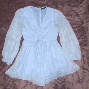 Chic White Mini Dress with Sheer Sleeves